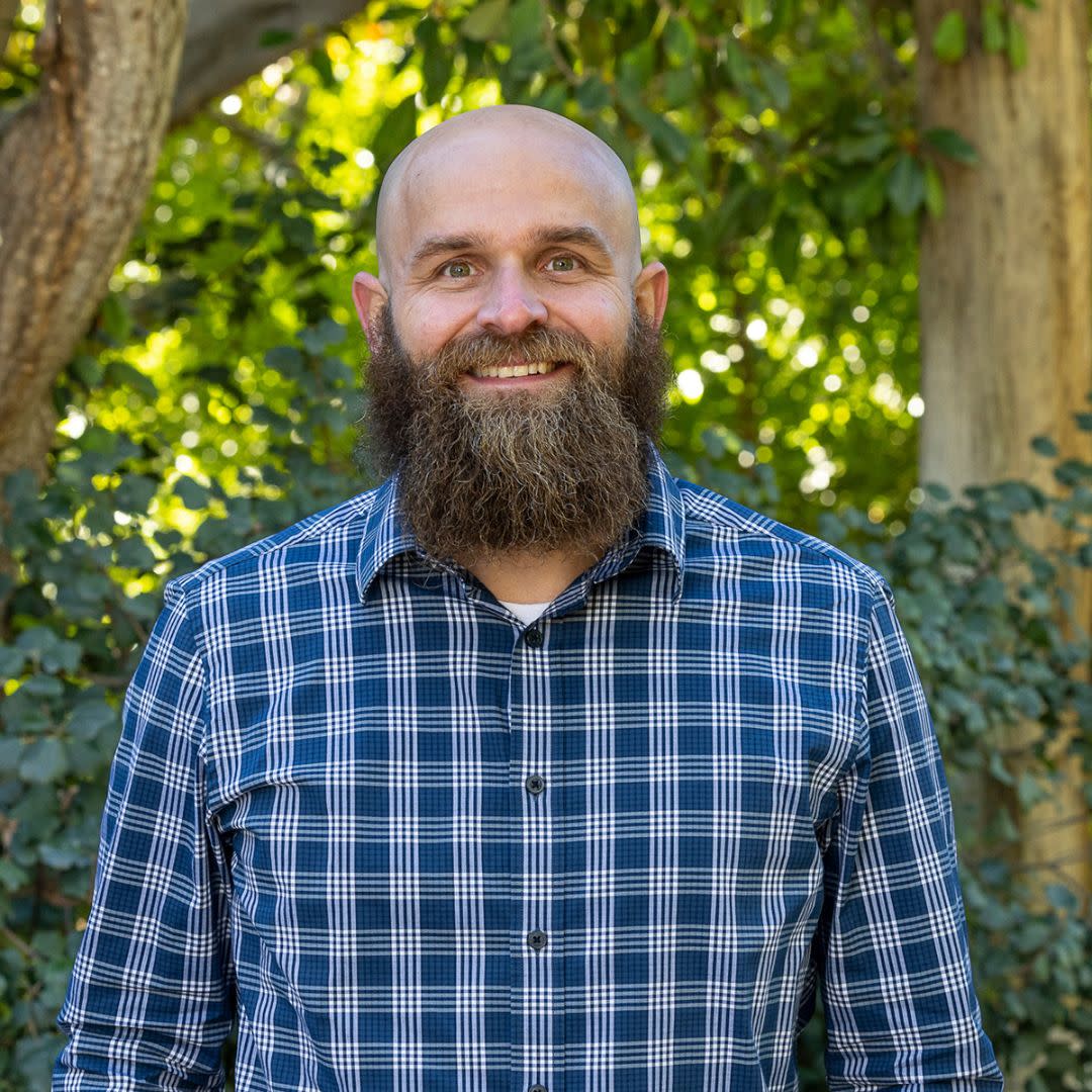 Matt Kinney smiles at the camera. 