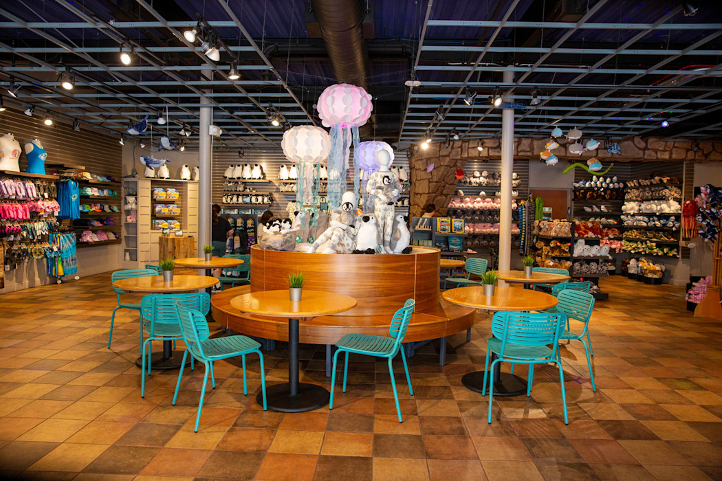 The interior of the Coast Gifts shop, featuring plush and a table with jellies.