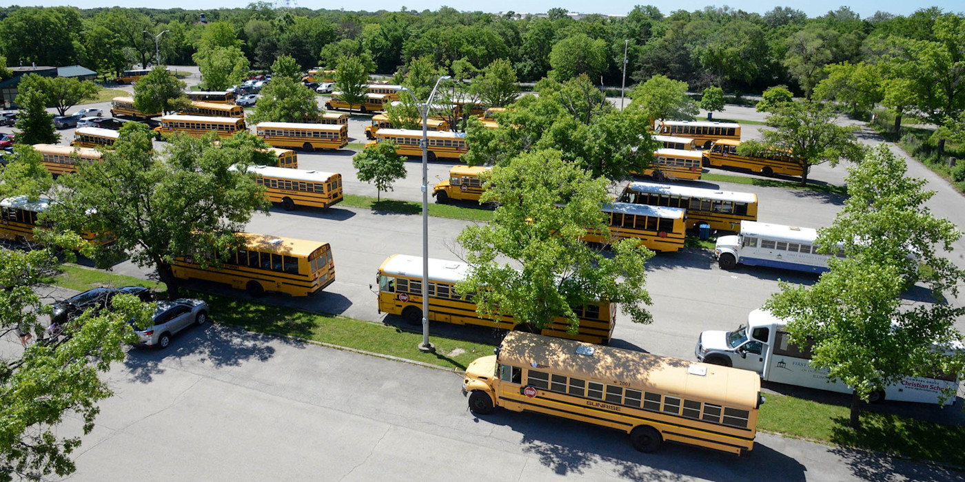 A photo of school busses parked outside of Brookfield Zoo Chicago.