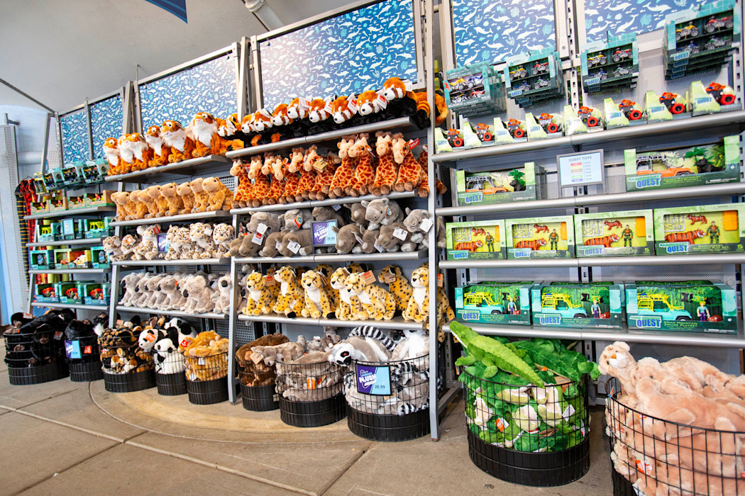 The interior of the Dolphin Bay gift shop, featuring plush of many Zoo animals. 