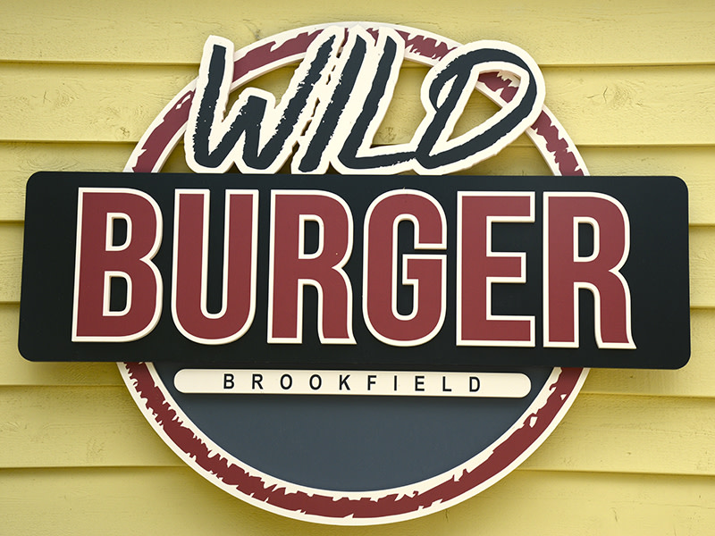 Close up photo of the Wild Burger logo outside of the Wild Burger Brookfield restaurant.